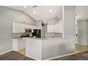 Kitchen with white cabinets and black appliances at 5018 25Th E St, Bradenton, FL 34203