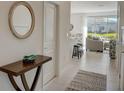 Bright and airy entryway with view into the living room at 5725 Haven Ter, Nokomis, FL 34275