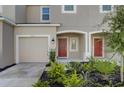 Townhouse exterior with attached garage and landscaping at 5725 Haven Ter, Nokomis, FL 34275