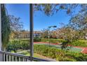 View of tennis court from screened patio at 850 S Tamiami Trl # 833, Sarasota, FL 34236