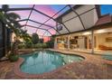 Inviting pool and patio with covered lanai and spa at 14619 Leopard Creek Pl, Lakewood Ranch, FL 34202