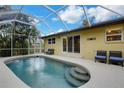 Inviting pool area with screened enclosure, ample seating, and a serene atmosphere at 251 Plantation Rd, Venice, FL 34293
