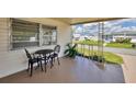 Cozy front porch with seating area, perfect for relaxing outdoors at 718 50Th Avenue W Dr, Bradenton, FL 34207
