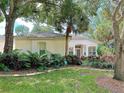 Luxury home with landscaping and palm trees at 5658 Downham Meadows, Sarasota, FL 34235