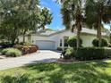 Luxury home with circular driveway and landscaping at 5658 Downham Meadows, Sarasota, FL 34235