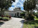 Luxury home with circular driveway and landscaping at 5658 Downham Meadows, Sarasota, FL 34235