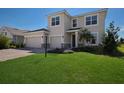 Two-story house with a two-car garage and paver driveway at 4322 Silo Port Ct, Lakewood Ranch, FL 34211