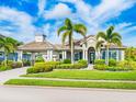 Beautiful single-story home with a lush, landscaped yard and a covered carport at 576 Fore Drive, Bradenton, FL 34208