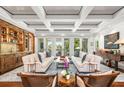Spacious living room with coffered ceiling, hardwood floors, and comfortable seating at 501 Harbor Point Rd, Longboat Key, FL 34228