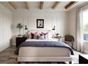 Beautifully decorated main bedroom featuring a large bed, stylish rug, wood-exposed beams, and natural light from a window at 766 Hillshire Pl, Spring Hill, FL 34609