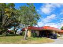 Single-story home with carport, landscaping, and a tranquil atmosphere at 9612 Valencia Cv, Bradenton, FL 34210