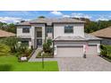 Two story house with modern exterior and landscaping at 16215 Tradewind Ter, Lakewood Ranch, FL 34211