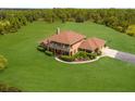 Two-story house with a large yard and driveway at 7301 221St E St, Bradenton, FL 34211