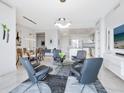 Open concept living area with modern furniture and kitchen access at 111 S Pineapple Ave # 605, Sarasota, FL 34236