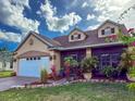 Charming home featuring a two-car garage, well-manicured lawn, and inviting, screened-in patio at 7209 49Th E Pl, Palmetto, FL 34221