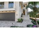 Two-story home with attached garage and walkway at 8030 Midnight Pass Rd, Sarasota, FL 34242