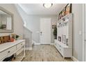 Entryway with tile floors, console table, and built-in storage at 2783 Butterfly Jasmine Trl, Sarasota, FL 34240