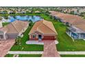 Aerial view of house, landscaping, and neighborhood at 2023 Mesic Hammock Way, Venice, FL 34292