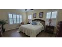 Comfortable bedroom with a queen-size bed and plenty of natural light at 4808 Charles Partin Dr, Parrish, FL 34219
