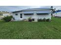 Rear view of single-wide manufactured home at 5317 Chateau Ln, Bradenton, FL 34207