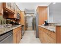Updated kitchen boasts stainless steel appliances, granite countertops, and ample cabinet space at 5855 Midnight Pass Rd # 319, Sarasota, FL 34242