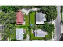 Bird's-eye view of four houses nestled together in a lush green neighborhood at 1569 7Th St, Sarasota, FL 34236