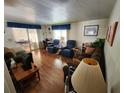 Spacious living room with hardwood floors and comfy seating at 5530 Denmark Dr, Bradenton, FL 34207