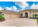 Two-car garage and a beautiful front entrance at 3342 Founders Club Dr, Sarasota, FL 34240