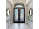 Elegant entryway with double doors and mirrors at 3342 Founders Club Dr, Sarasota, FL 34240