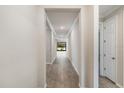 Bright hallway with tile flooring leading to other rooms at 260 Soliera St, Nokomis, FL 34275