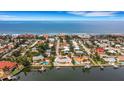 Aerial view of a home near the waterfront at 1903 Bayshore Dr, Belleair Beach, FL 33786