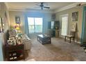 Bright living room with large windows and comfortable seating at 5146 Northridge Rd # 209, Sarasota, FL 34238