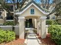 Condo entryway with covered walkway and building number at 5146 Northridge Rd # 209, Sarasota, FL 34238