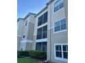 Exterior view of condo building showcasing screened balconies at 5146 Northridge Rd # 209, Sarasota, FL 34238