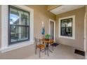 A cozy outdoor seating area provides a quaint spot to enjoy the fresh air and quiet surroundings at 317 Acerno Dr, North Venice, FL 34275