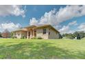 One-story house with a copper roof and expansive lawn at 6930 69Th E St, Palmetto, FL 34221