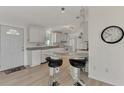 Modern kitchen with white cabinets and granite countertops at 634 Schooner St, North Port, FL 34287