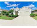 Lovely home showcases a well-maintained exterior with an attached two-car garage and beautiful landscaping at 12715 Lake Silver Ave, Bradenton, FL 34211
