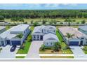 Community overview featuring multiple homes and lush landscaping at 8175 Redonda Loop, Lakewood Ranch, FL 34202