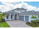 Two-story house with gray roof and double car garage at 8175 Redonda Loop, Lakewood Ranch, FL 34202