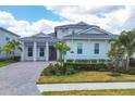 Two story house with gray roof and double car garage at 8175 Redonda Loop, Lakewood Ranch, FL 34202