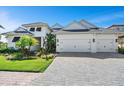 White two-story house with double garage at 16518 Cornwall Ln, Bradenton, FL 34202