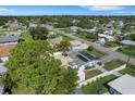 Aerial view of a house with solar panels and a fenced backyard at 1054 W Baffin Dr, Venice, FL 34293