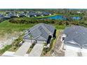Aerial view of community with homes and a pond at 4133 Golden Creek Ter, Parrish, FL 34219