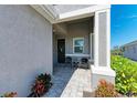 Welcoming front entry with seating area at 4133 Golden Creek Ter, Parrish, FL 34219