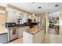 Modern kitchen with granite countertops and stainless steel appliances at 4966 Clubview E Ct, Bradenton, FL 34203