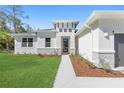 Front entry of a house with stone and walkway at 3371 Gowanda Ave, North Port, FL 34287