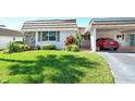 Updated single story home with carport and neatly kept lawn at 2607 Riverbluff Pkwy # V145, Sarasota, FL 34231