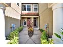Townhouse entry with walkway, landscaping, and double door entry at 228 Crew Ct, Sarasota, FL 34243