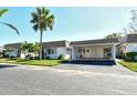 Condo exterior, carport, palm tree at 2020 Riverbluff Pkwy # V329, Sarasota, FL 34231